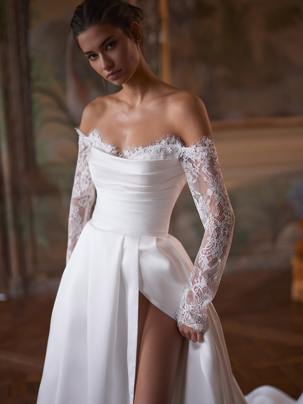 Manually added from URL: https://www.zoyaweddingcenter.sk/sites/default/files/styles/detail_galeria__tvorec/public/695fcbeb3b2f931cbc5493fb_model-548-capella-2.jpg?itok=v33_dk70